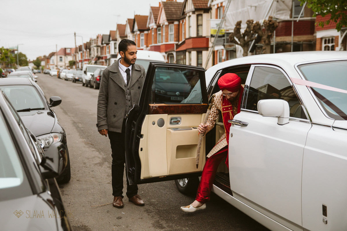 sikh groom getting out of the car