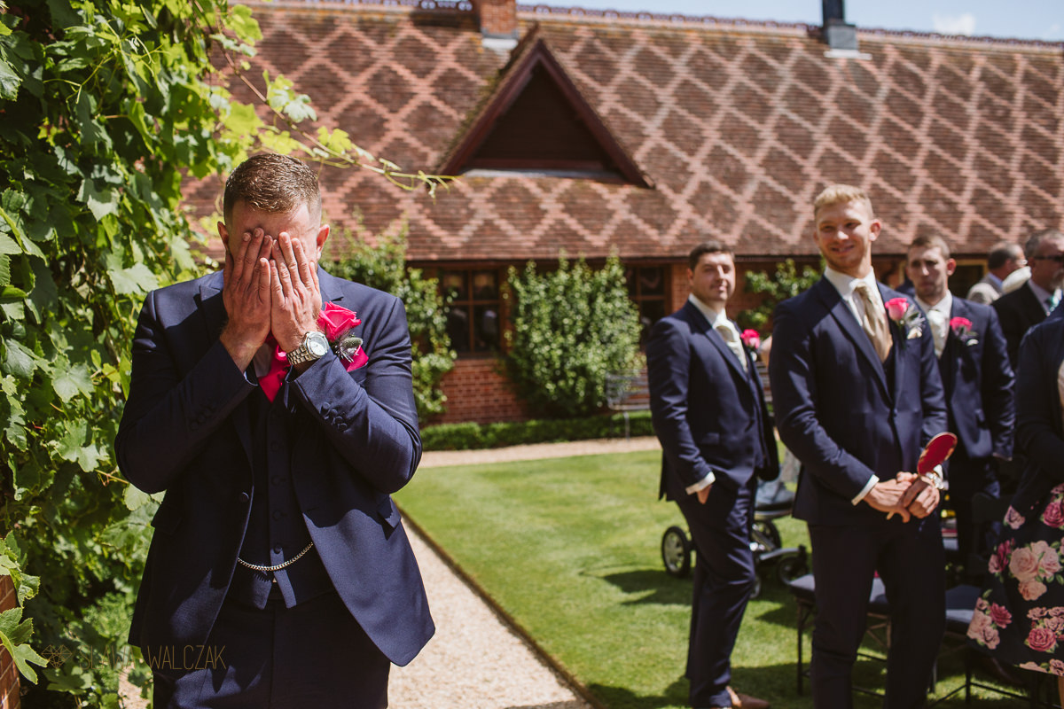 groom awaiting his bride at a wedding in The Dairy in Waddesdon