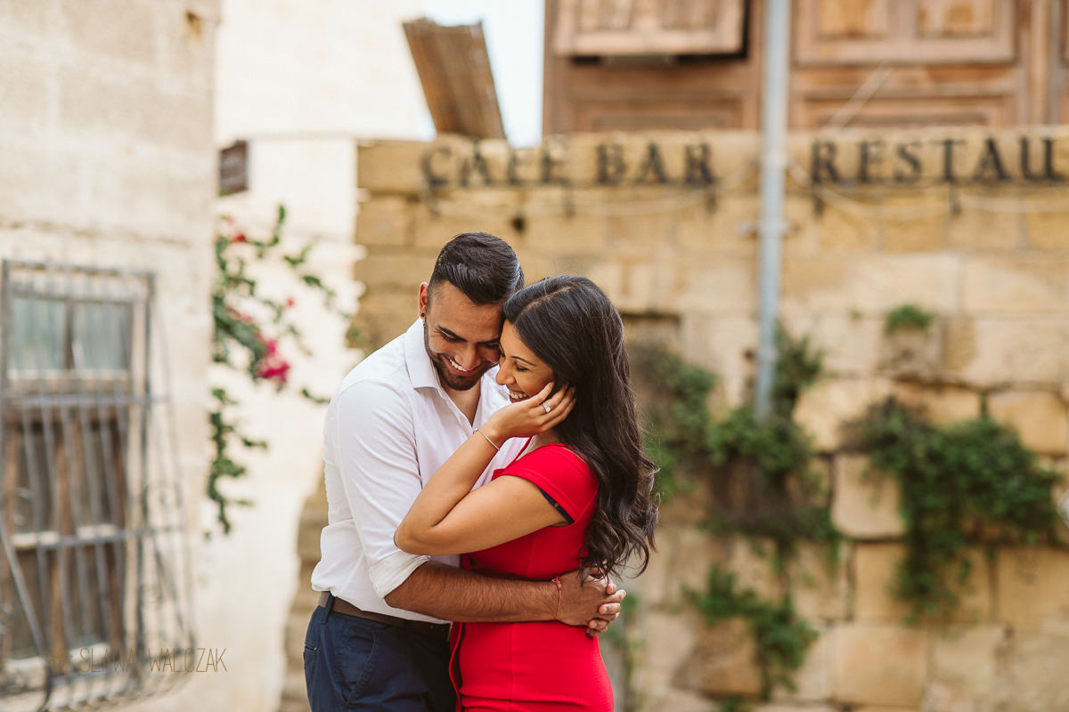 Couple posing for their engagement photos on the streets of Valletta in Malta