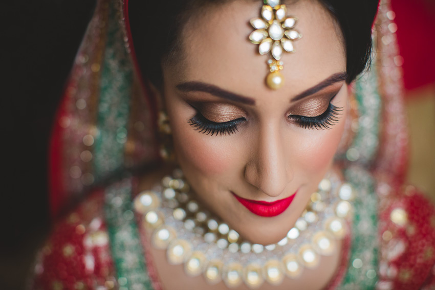 sikh punjabi bride posing for a portrait photo during her asian london wedding