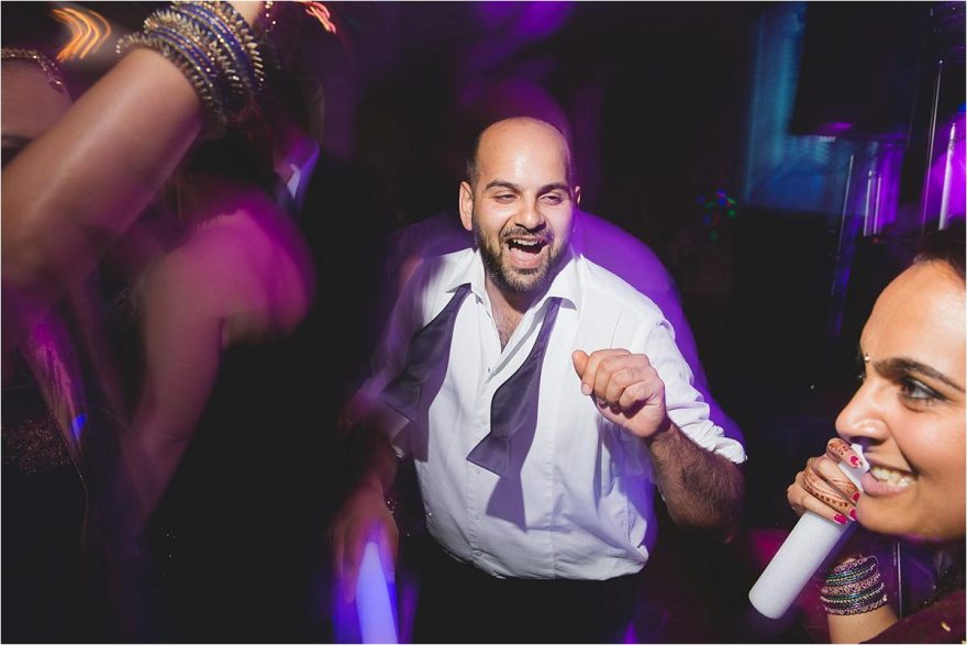 indian happy guy dancing at a wedding