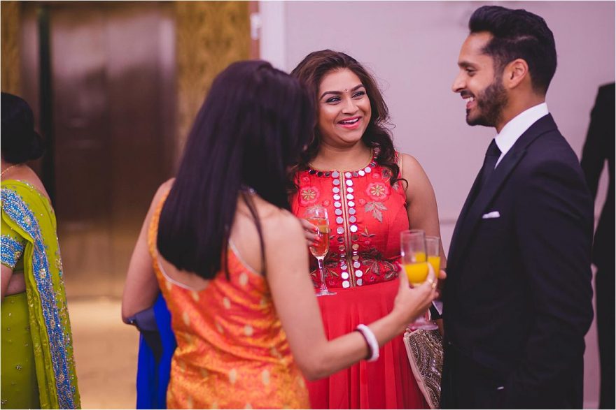 young indian ladies smiling at a wedding