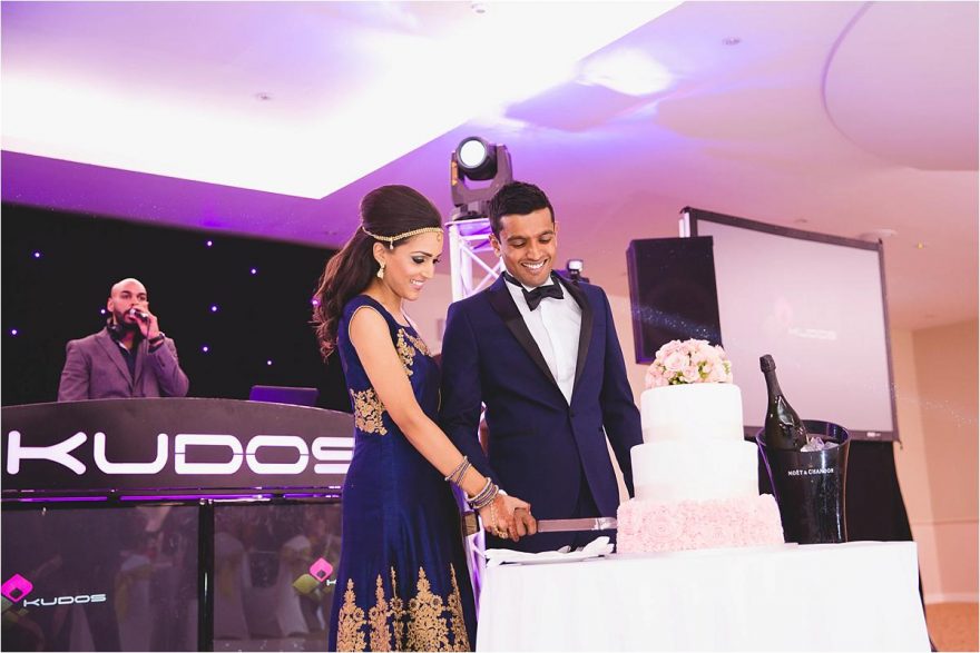 cake cutting at an indian wedding in london