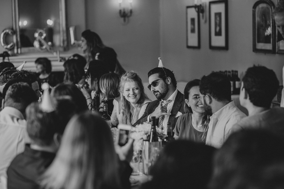 photos of guests having fun at a London wedding in Drapers Arms pub