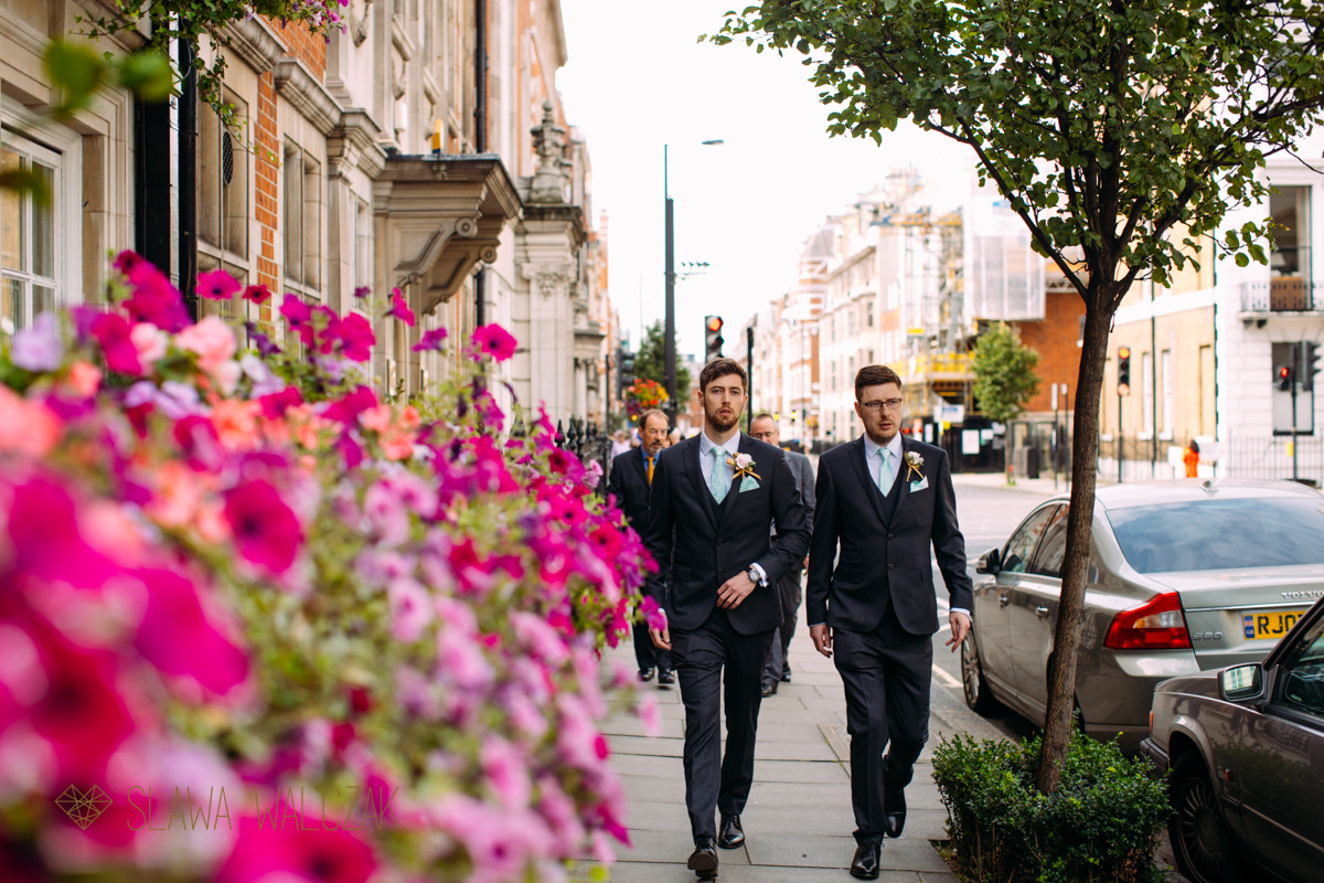 Groom and his brother walk to Asia House for a wedding