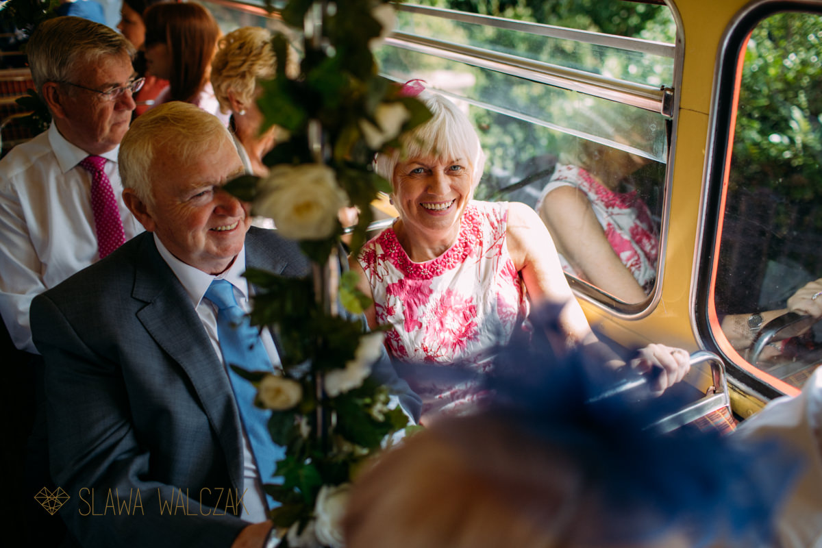 wedding guests on a journey on London Routemaster bus
