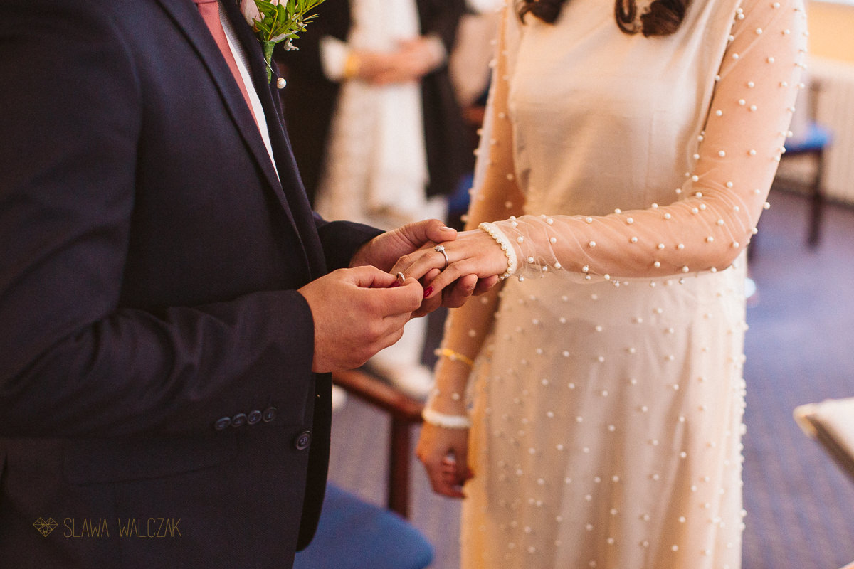 detail shot of the ring exchange at a civil wedding in Ealing Register Office