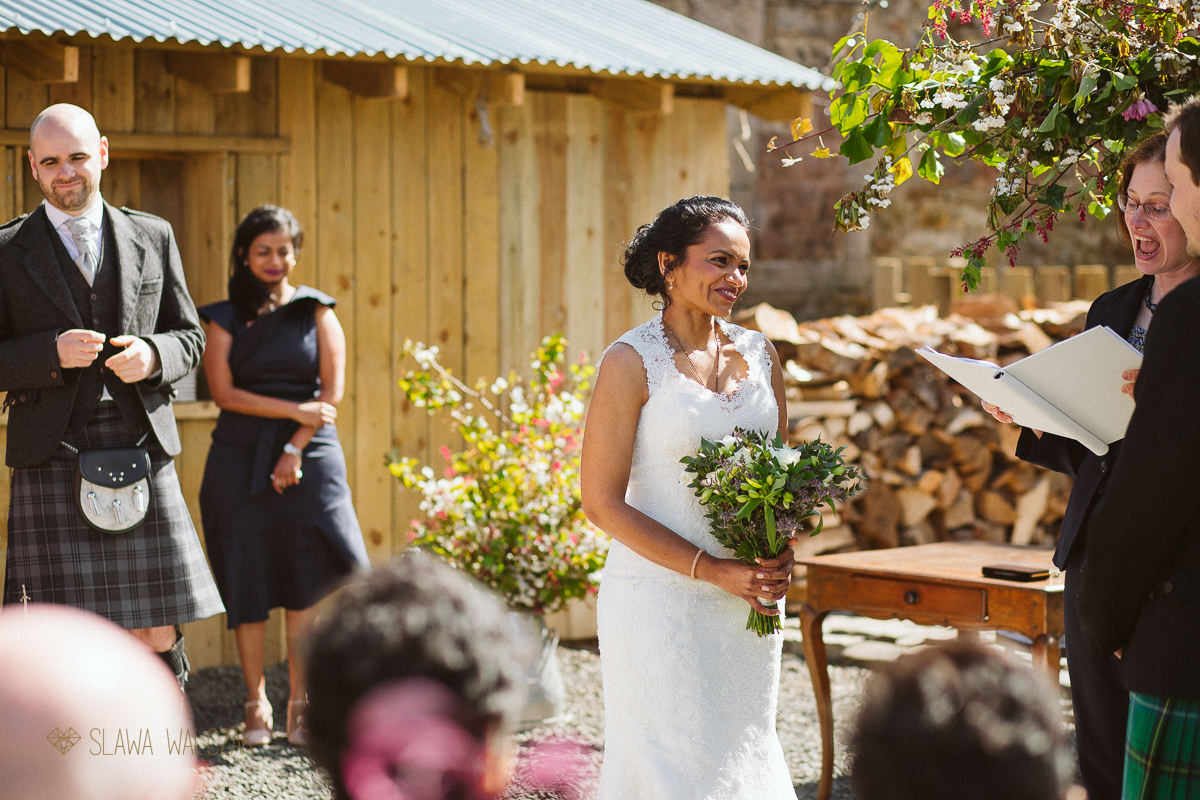 outdoor humanist ceremony during a farmhouse Wedding in Scotland