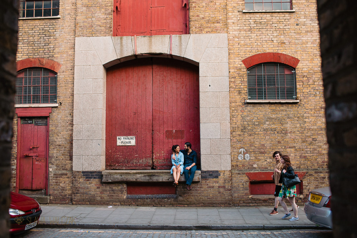 indian couple posing for their relaxed pre wedding photos on Wapping Wharf