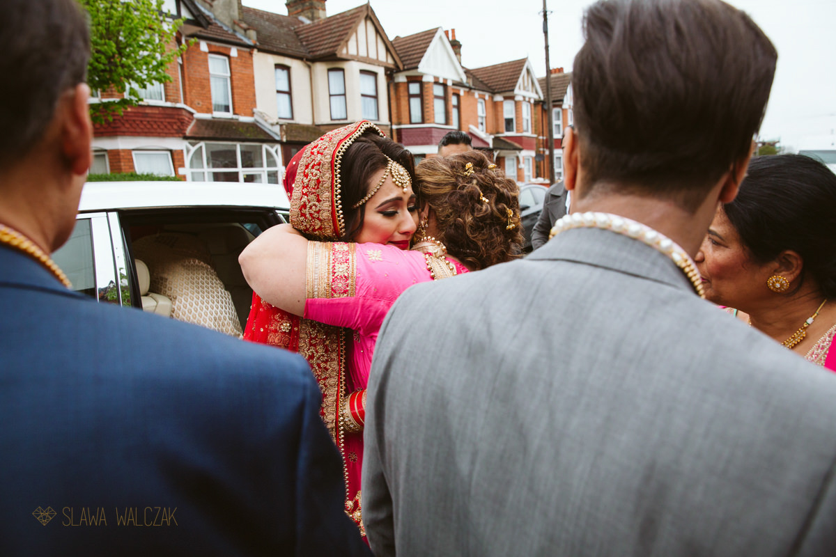 Indian bride having her Vidai during her Sikh wedding in London