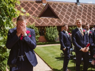 groom awaiting his bride at a wedding in The Dairy in Waddesdon