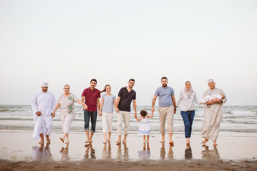 candid family photo shoot from a Muscat beach