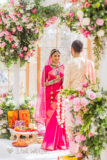 garlands exchange by a female Indian wedding photographer in London