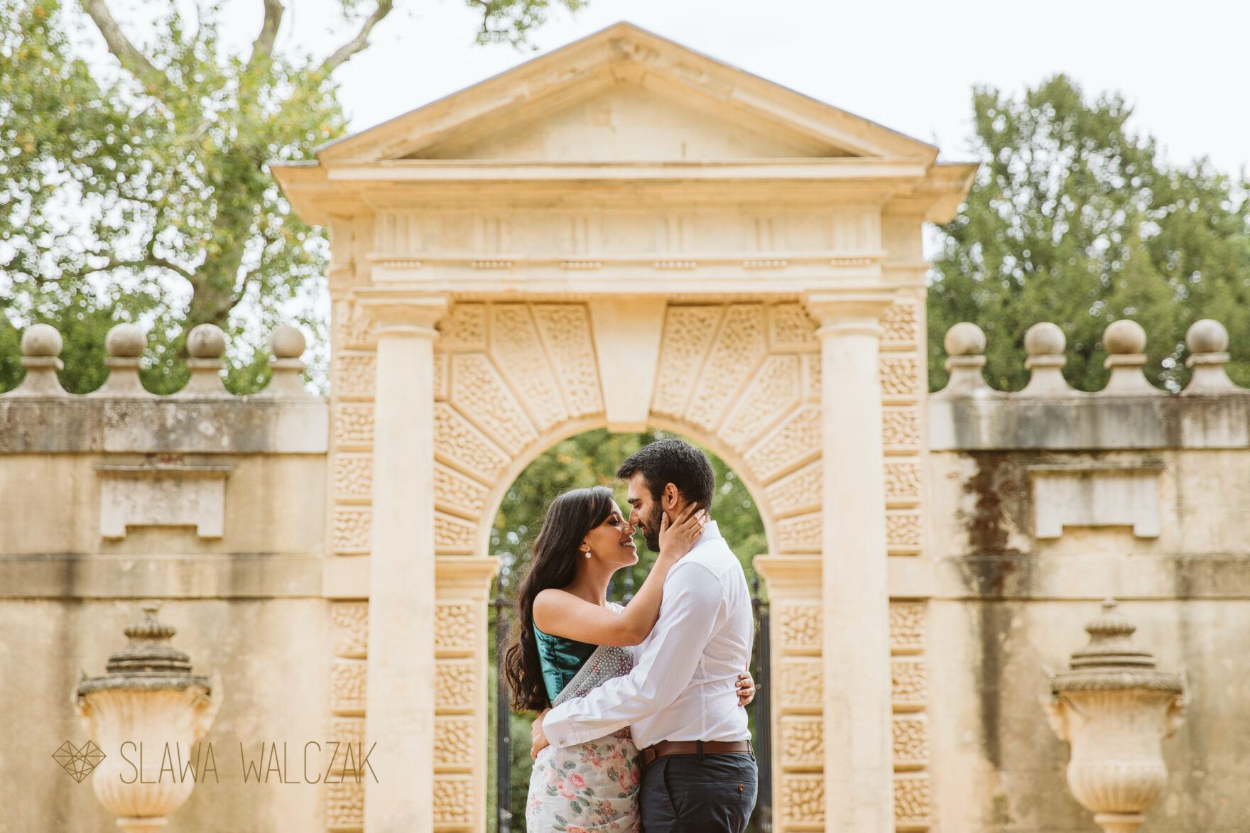 Natural and romantic engagement photo shoot Chiswick House Asian couple embrace each other romantically