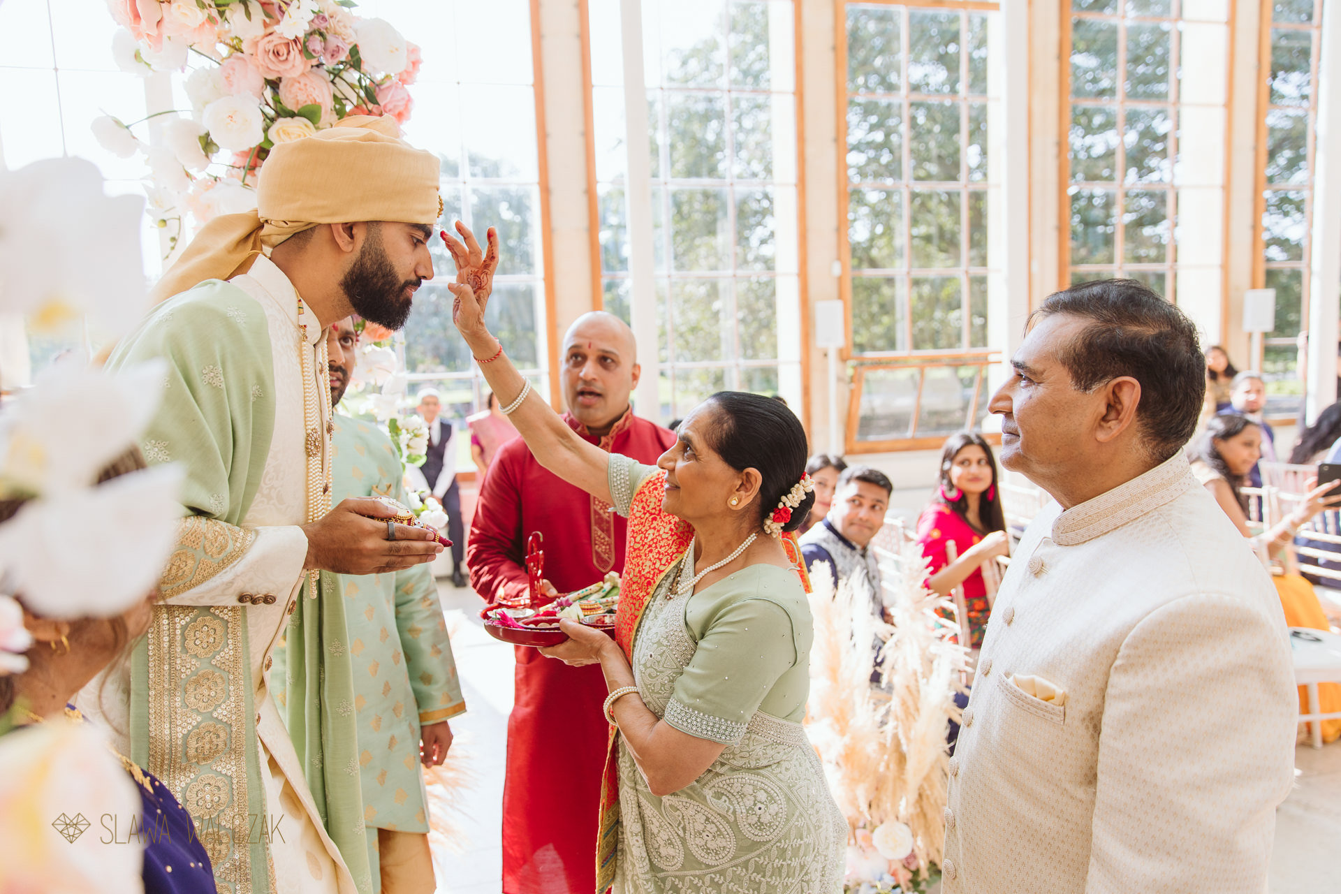 photo of a Indian groom entering Kew Gardens for his wedding