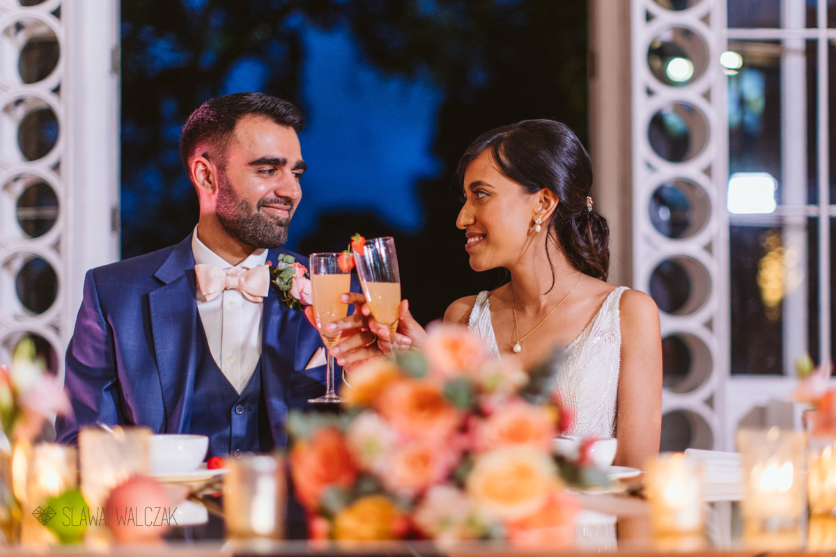 indian couple toasting at their wedding