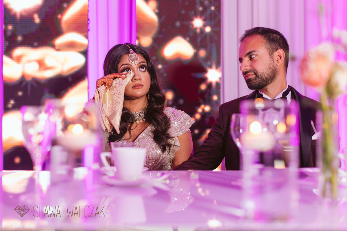bride crying during speeches at her wedding in Landmark Hotel London