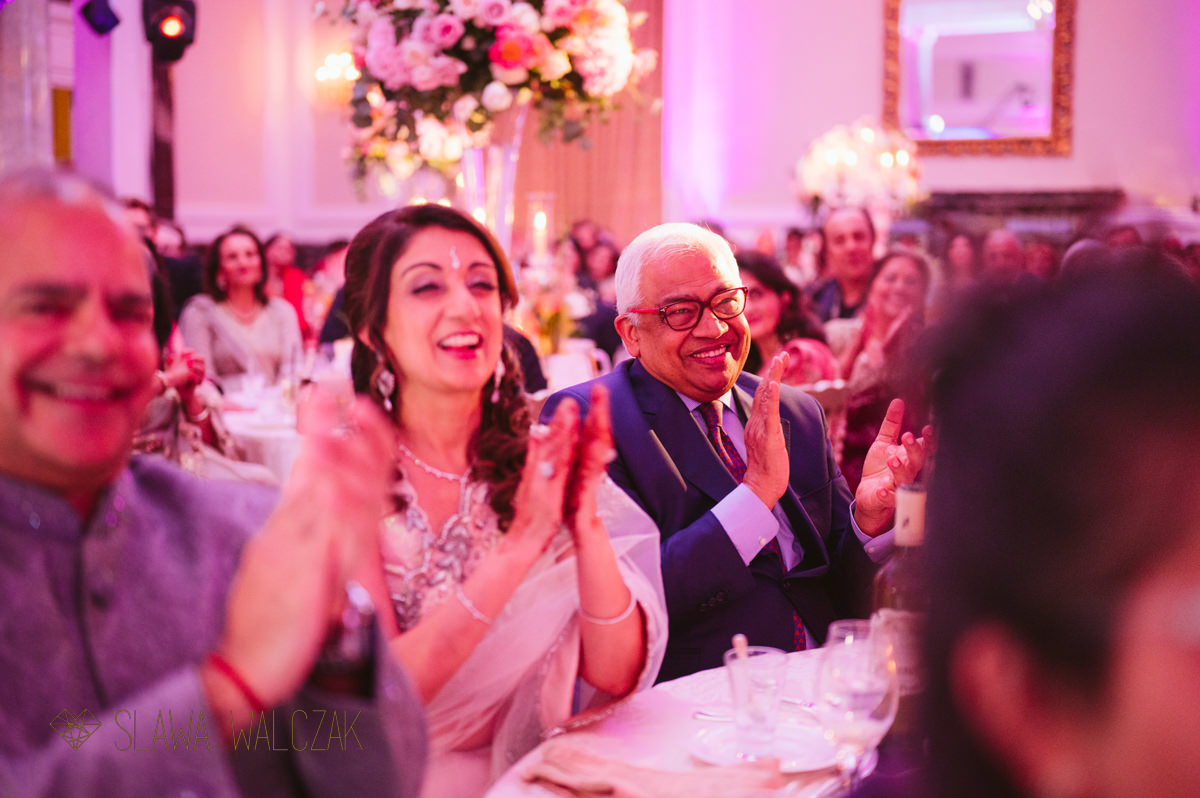 guests laughing during speeches at a wedding in Landmark Hotel London